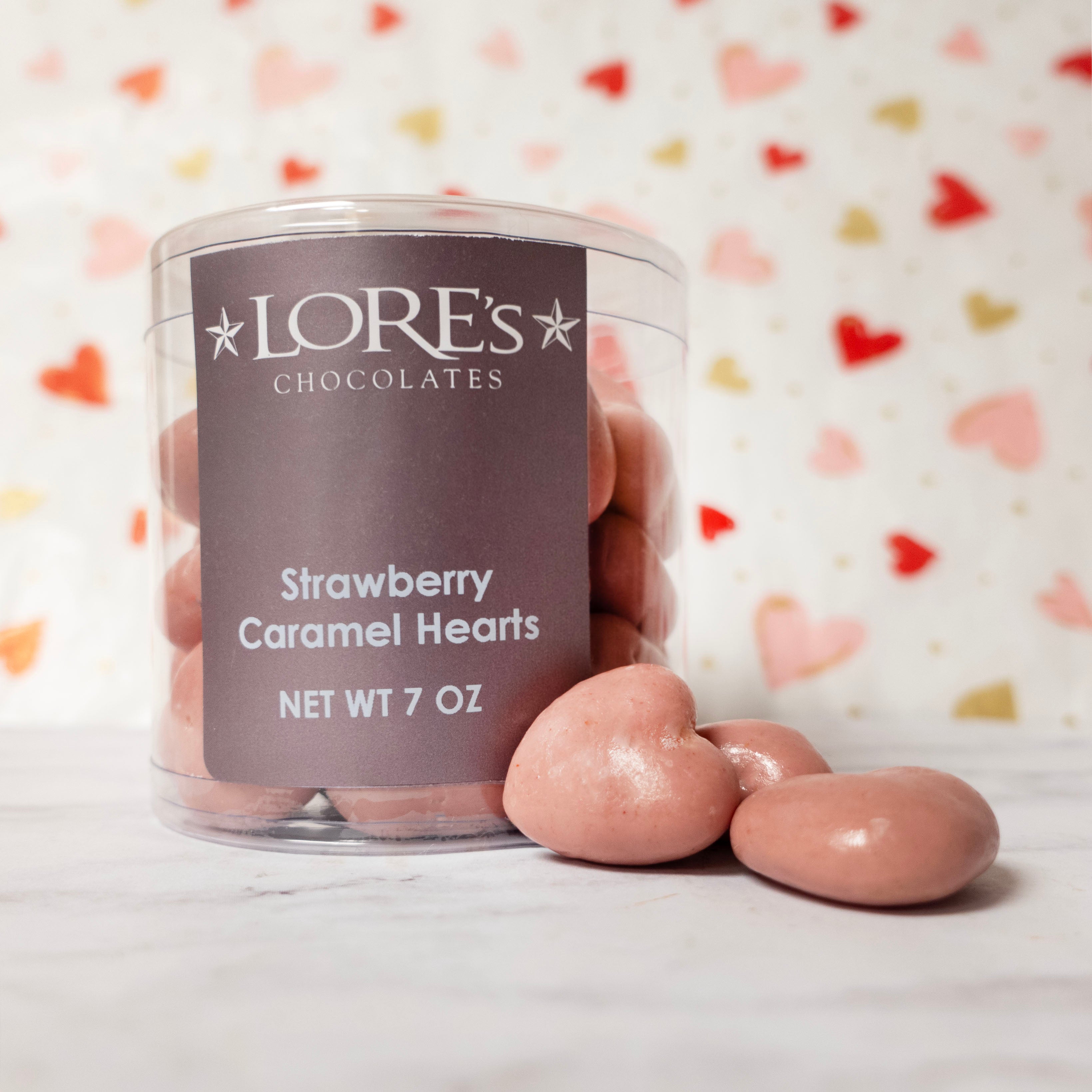 Jar of Lore's Strawberry Caramel Hearts with a heart-patterned background