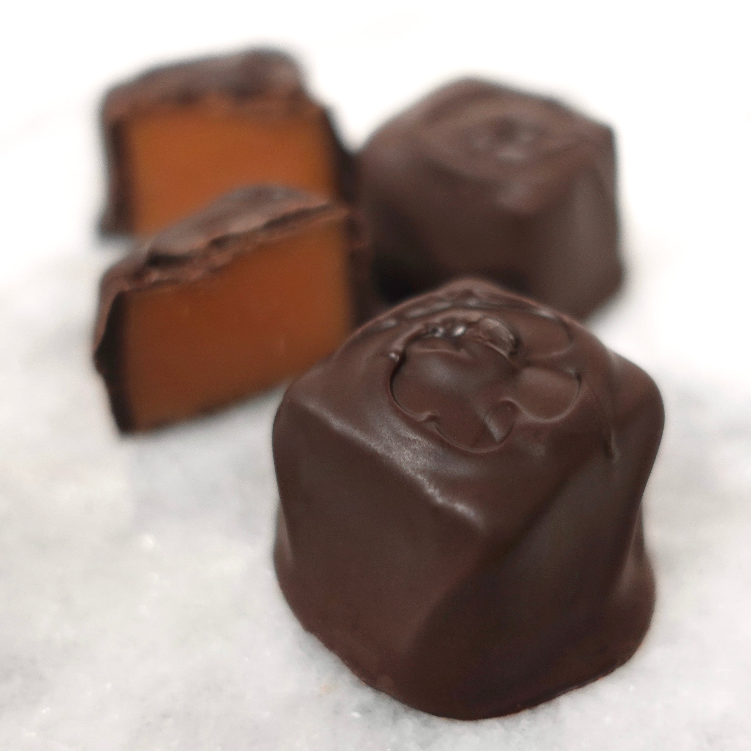 Close-up of chocolate candies on a white background