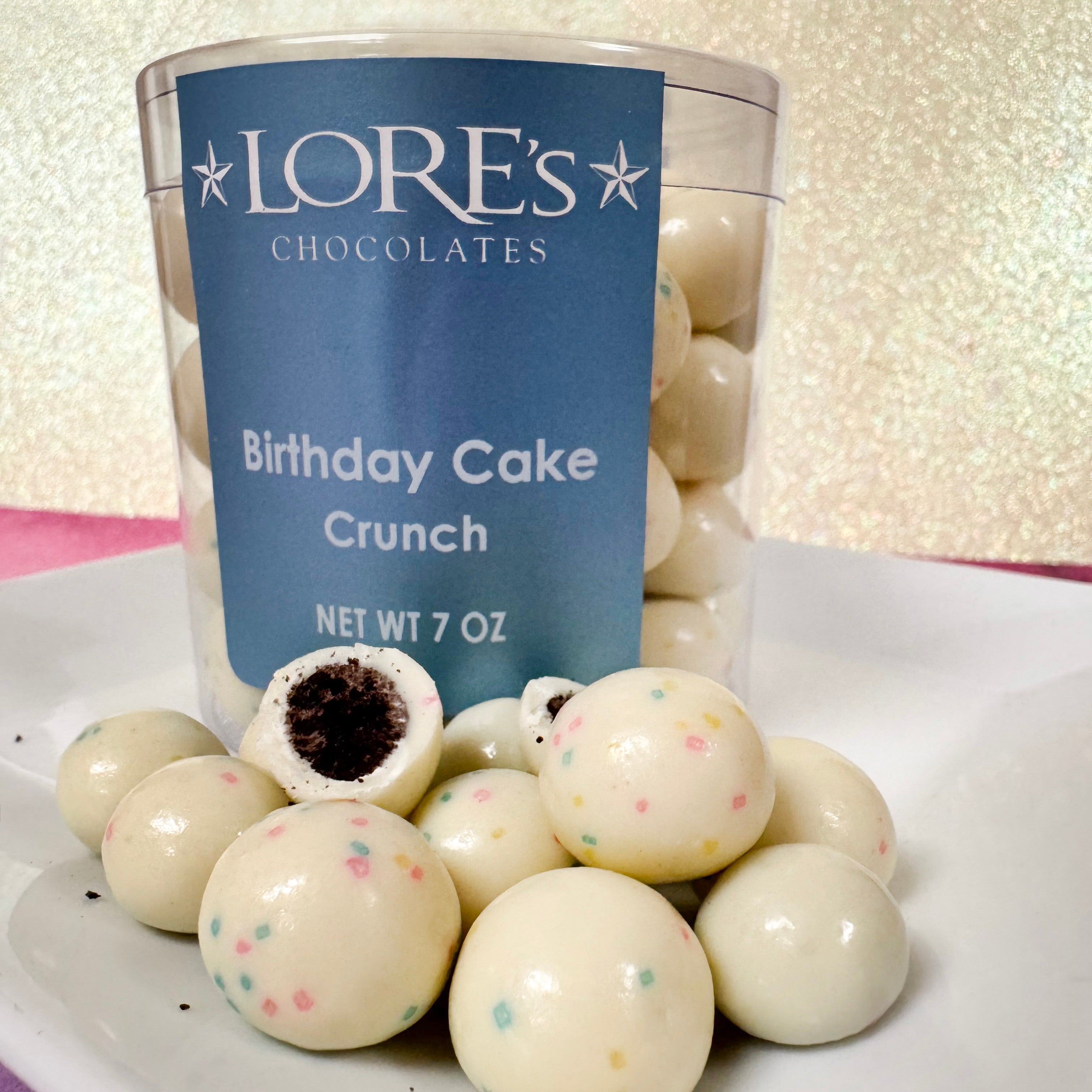 Lore's Chocolates Birthday Cake Crunch on a white plate with a glittery background