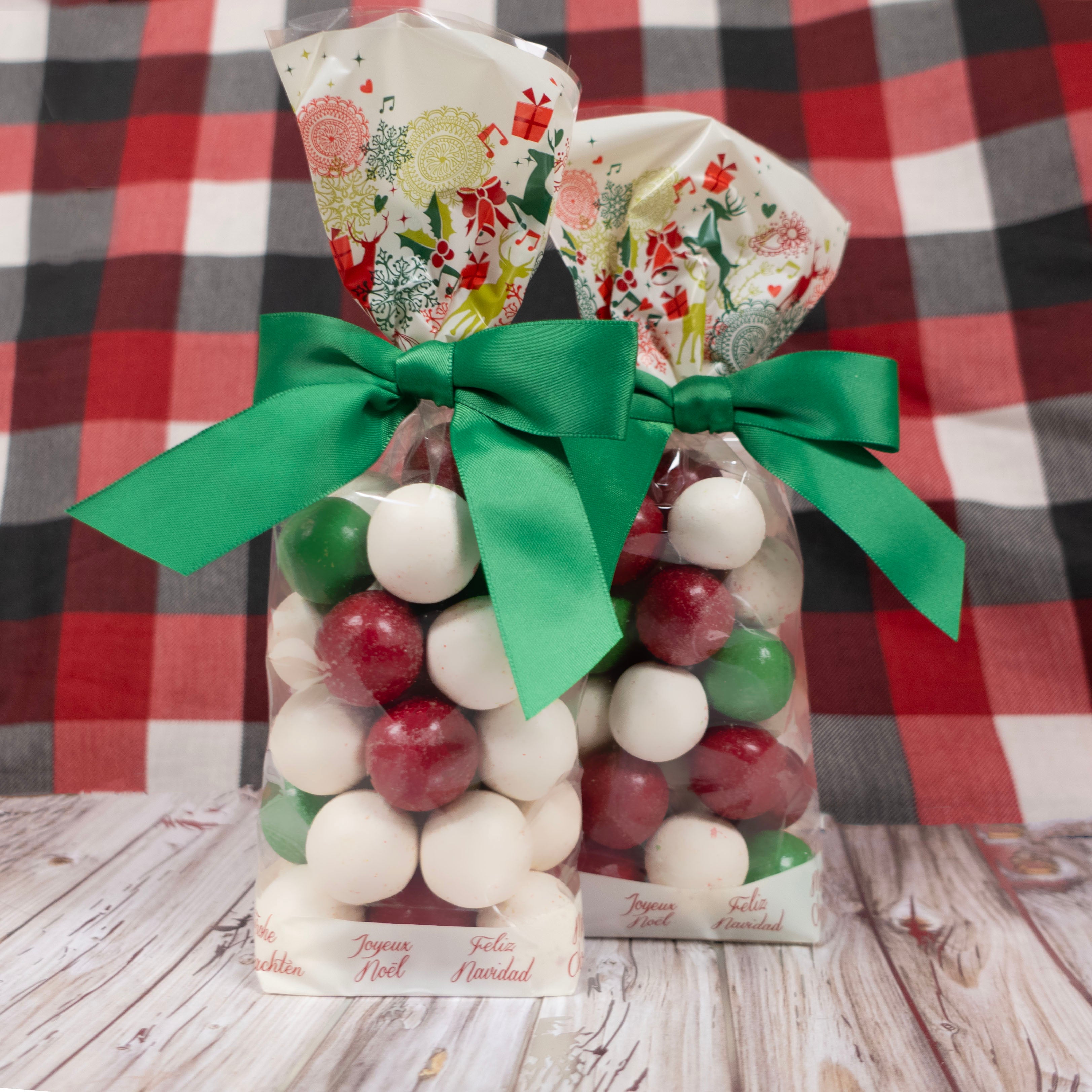 Bag of colorful malt ball chocolate candies with a green ribbon on a checkered background