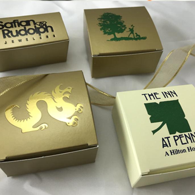 Custom 4-piece chocolate boxes with various business and organization logos