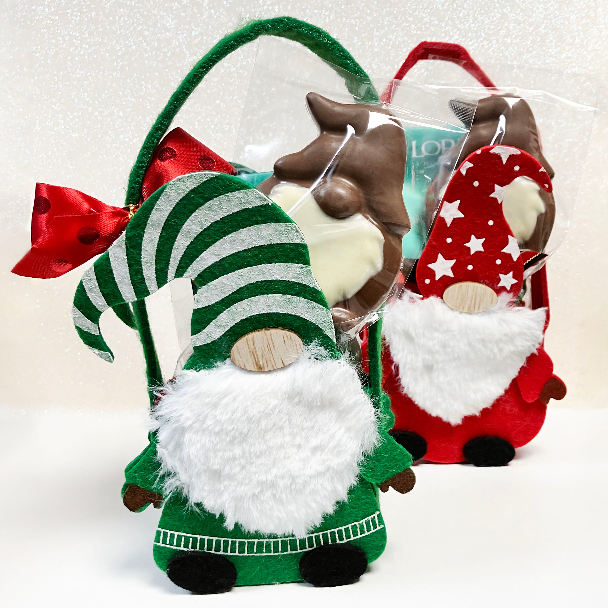 christmas gnome-shaped felt gift bags with different designs in either red or green on a white sparkly background