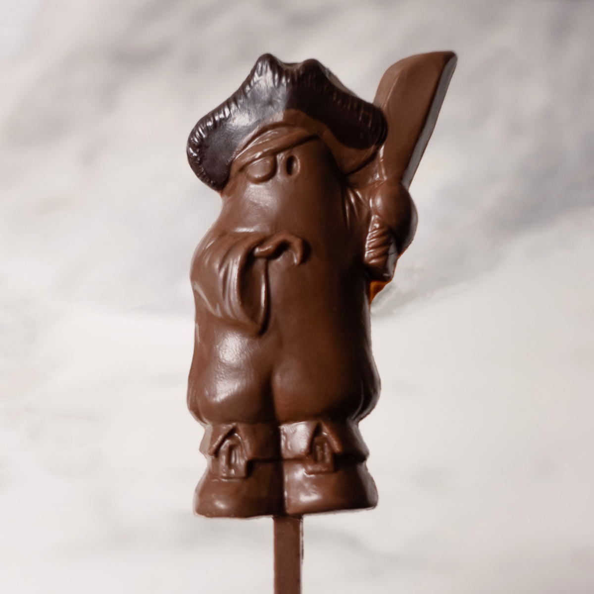 Milk Chocolate Ghost Pirate on a lollipop stick with a white background