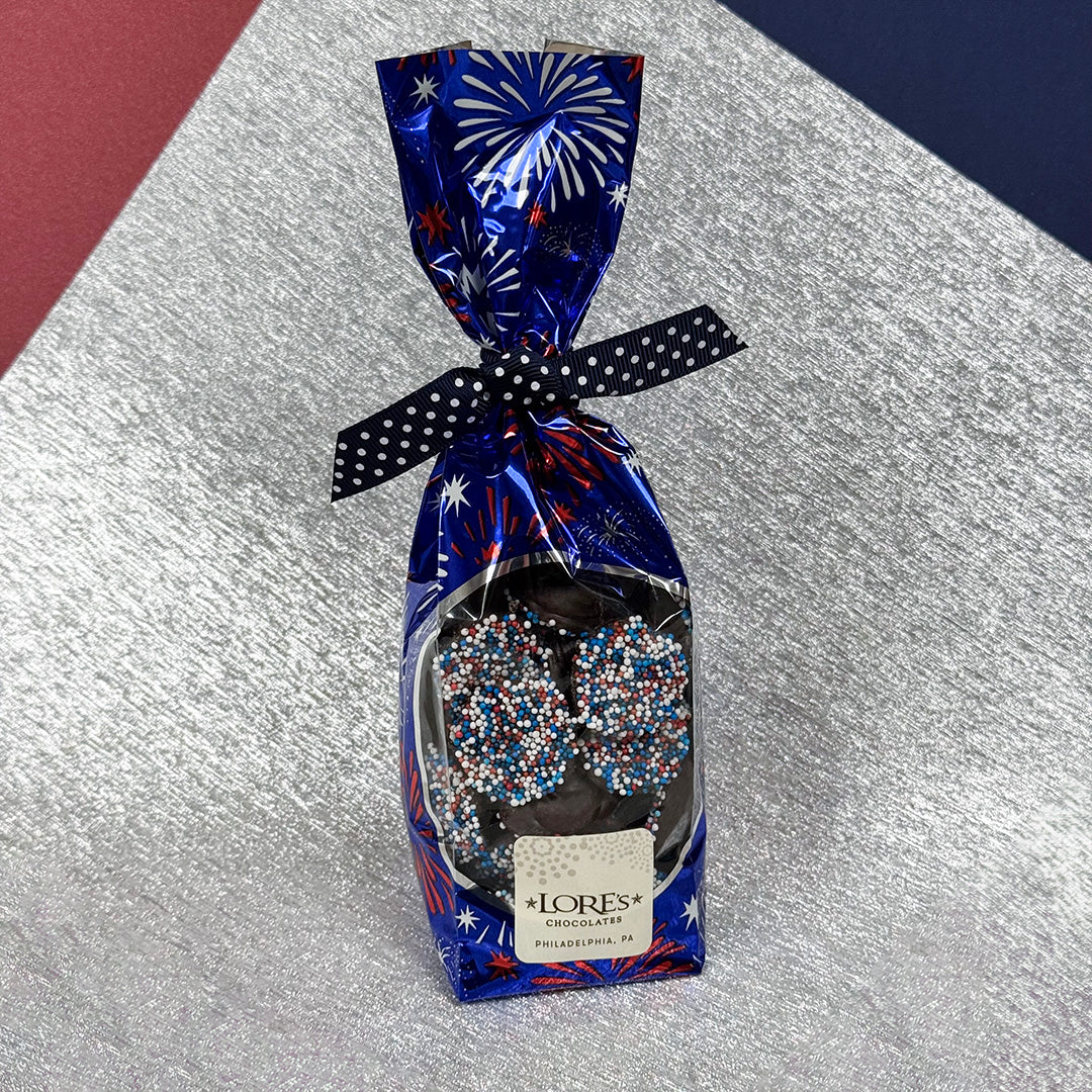 Chocolate gift bag of patriotic nonpareils with festive design on a metallic surface - Lore's Chocolates in Philadelphia
