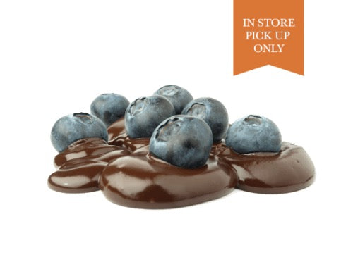 Fresh blueberries sitting on delicious melted chocolate from Lore's in Philadelphia.
Flag in top right of image reads "In Store Pick Up Only"