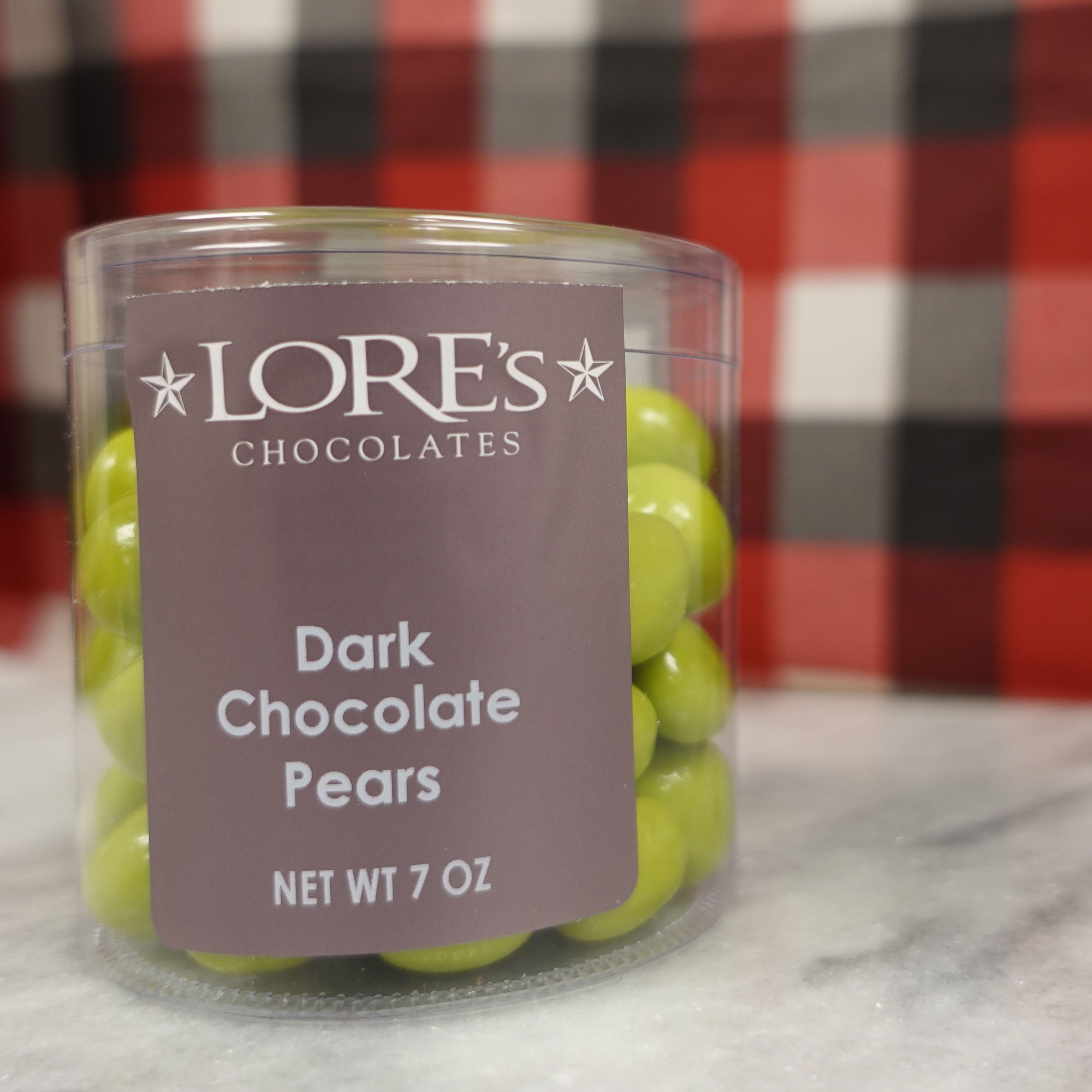 Lore's Chocolates Dark Chocolate Pears with a festive christmas background