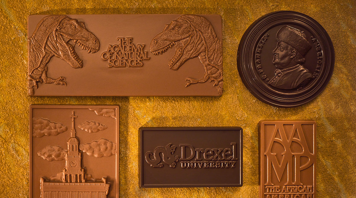 Custom chocolate bars in both milk chocolate and dark chocolate featuring images of philadelphia businesses and organizations - made by lore's chocolates